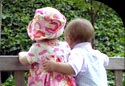 Image of two children arm-in-arm